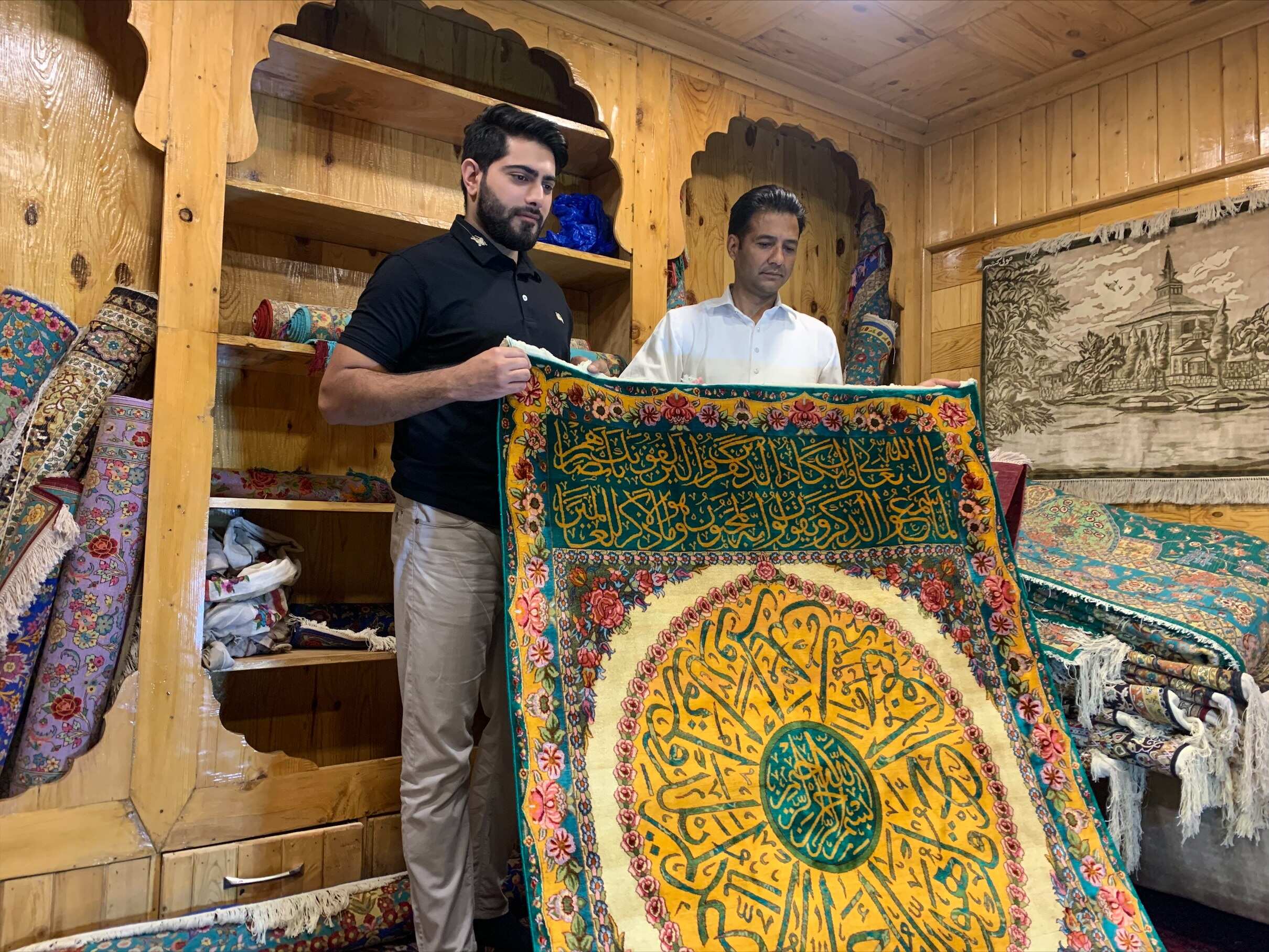 Craftsman uses calligraphy on Kashmiri silk carpets, demand increases